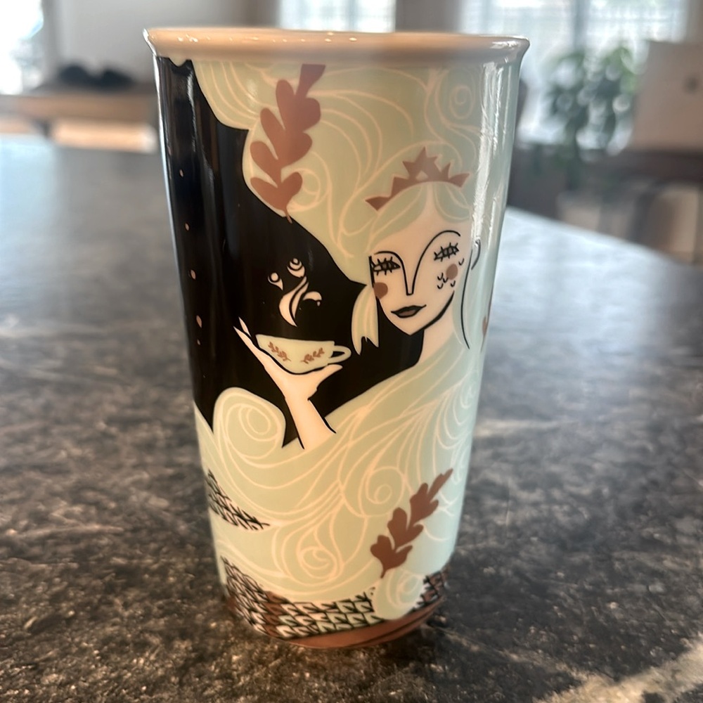 Starbucks, black green and gold 12 fluid ounce coffee cup